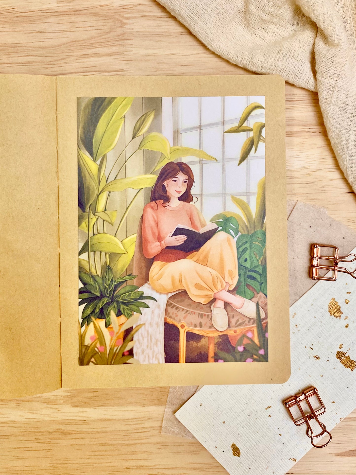 art print of a girl reading and plants around